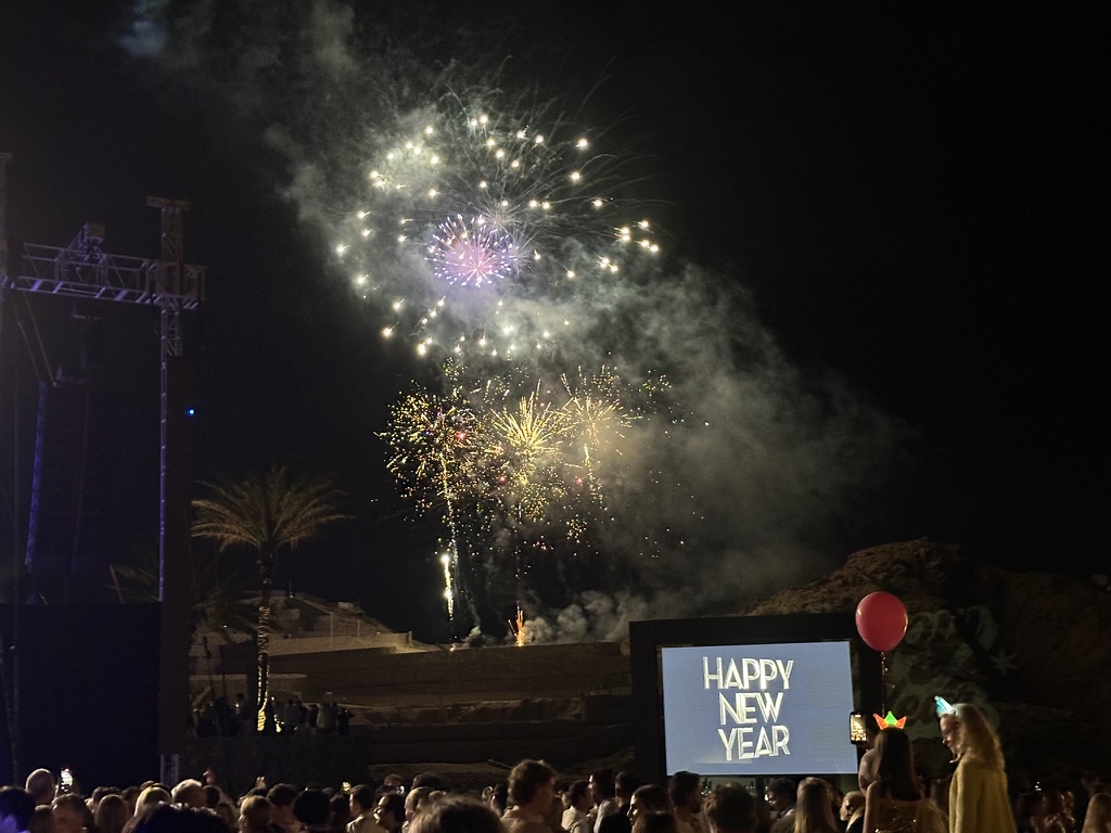 New Years Eve fireworks over crowd with LED screen resort event Cabo San Lucas