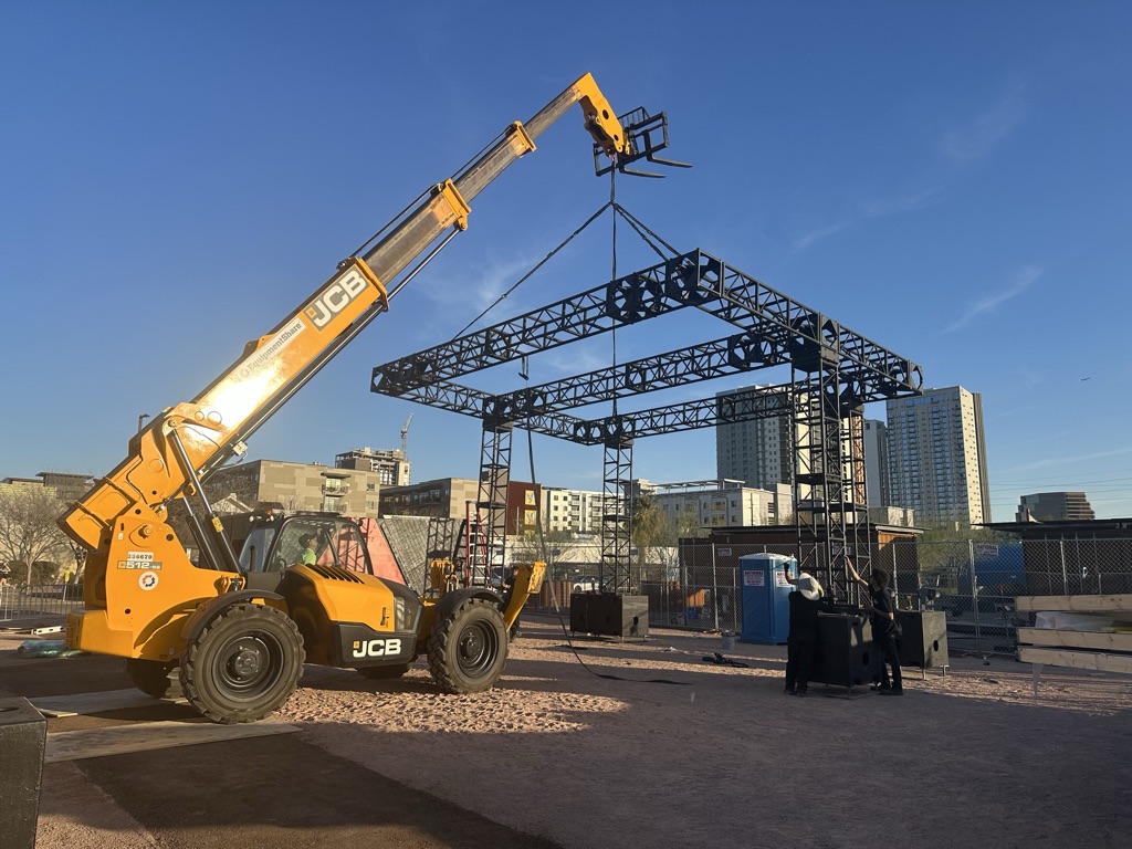 Wide view steel truss structure JCB telehandler downtown skyline event activation Phoenix AZ