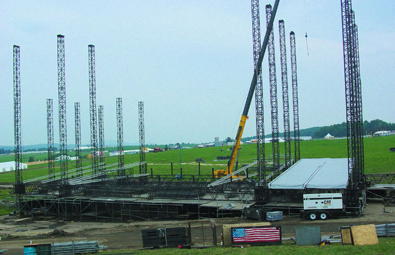 Main stage steel truss going vertical crane lift Phish IT Festival Limestone ME 2003